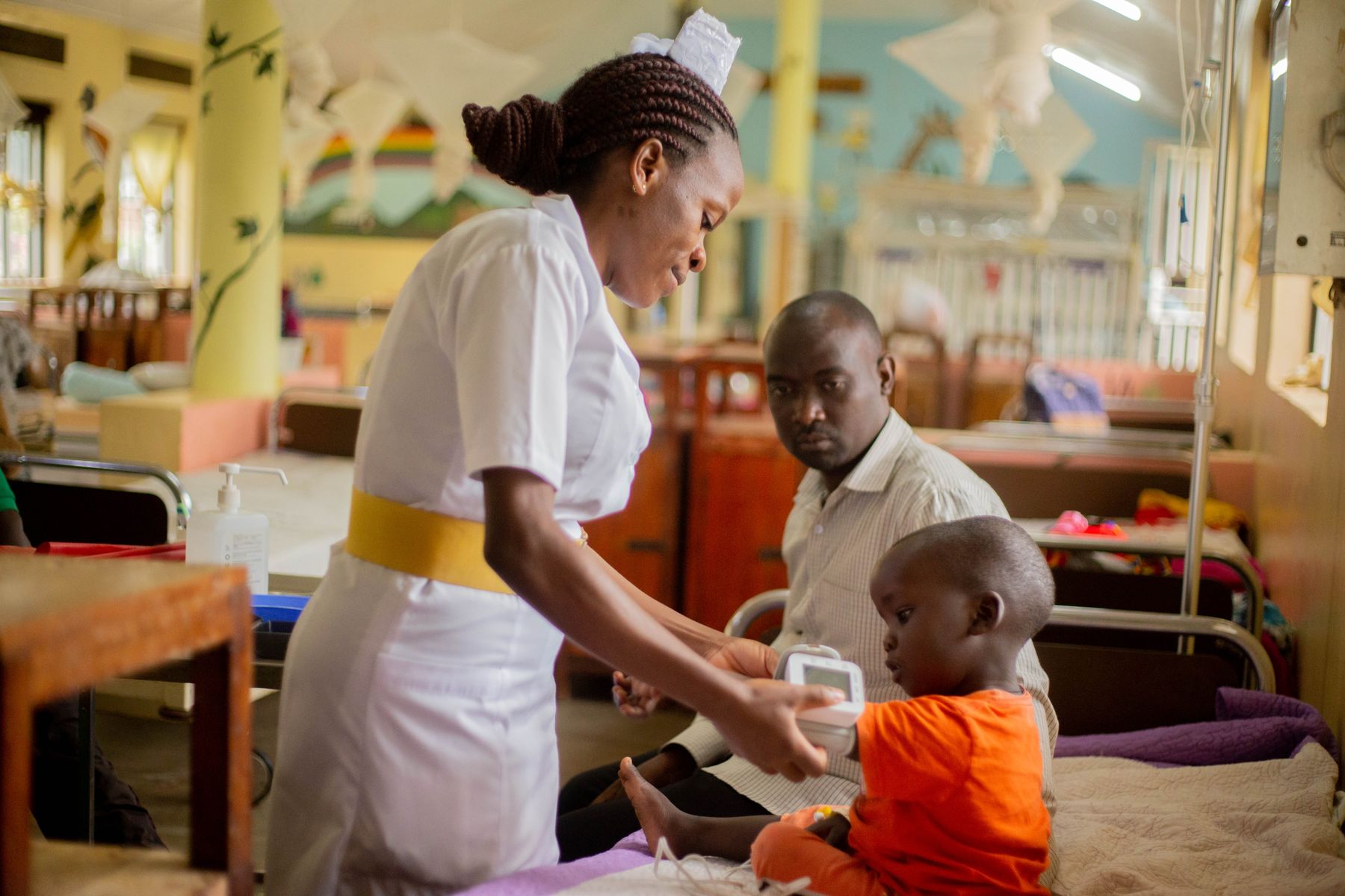 A nurse attending to a patient at a clinic